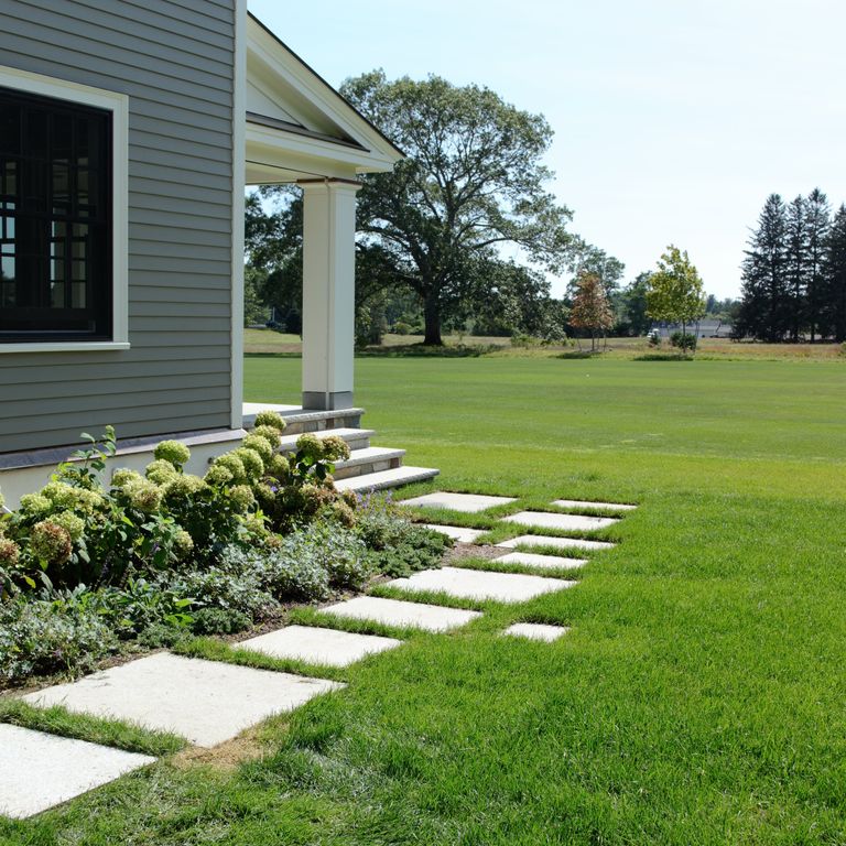 The image shows this material being used in a path pavers application. Dominant colors shown are blue and gray.