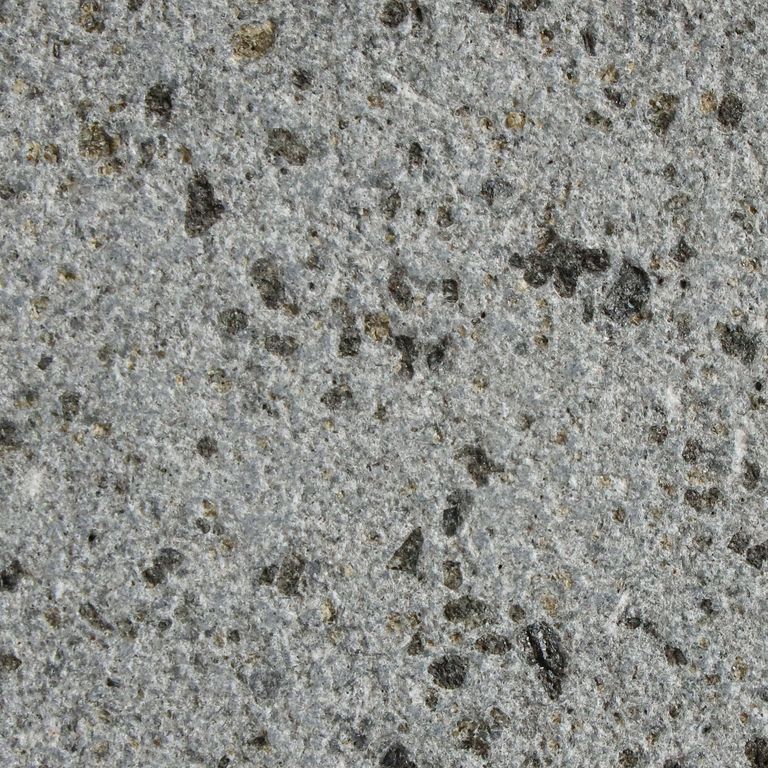 Color/Finish variation image for Basalto Basalt. The surface finish shown is sand blasted. The dominant color shown is gray; with beige, blue, brown, green, purple and white secondaries. The color mix creates a cool feeling. Solid color pattern.