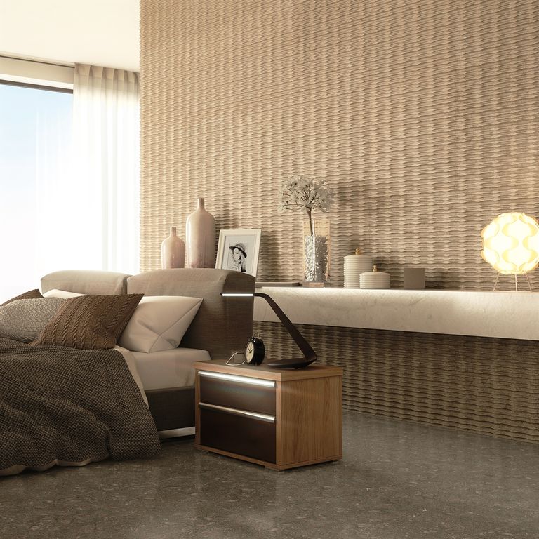Application image for Fossil Gray Limestone. The image shows this material being used in an interior floor application. The dominant color shown is gray. The color mix creates a warm feeling.