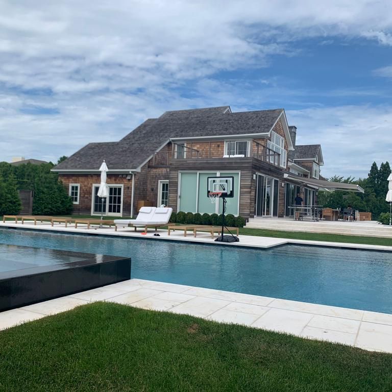 Application image for Veneto Beige Limestone. The image shows this material being used for pool coping, monolithic steps and pool deck pavers. The surface finish shown is flamed. Dominant colors shown are beige, tan and cream; with a white secondary. The color mix creates a cool feeling. Regular color pattern.