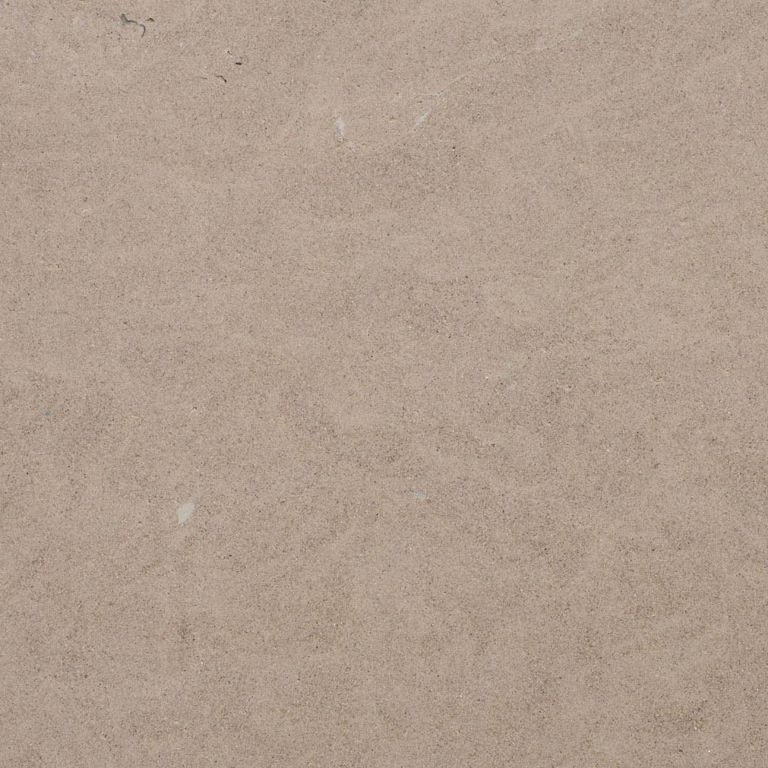 Best close-up image for Giallo Avorio Limestone. The surface finish shown is honed. Dominant colors shown are brown and tan; with beige, gray and orange/rust secondaries. The color mix creates a warm feeling. Regular color pattern.