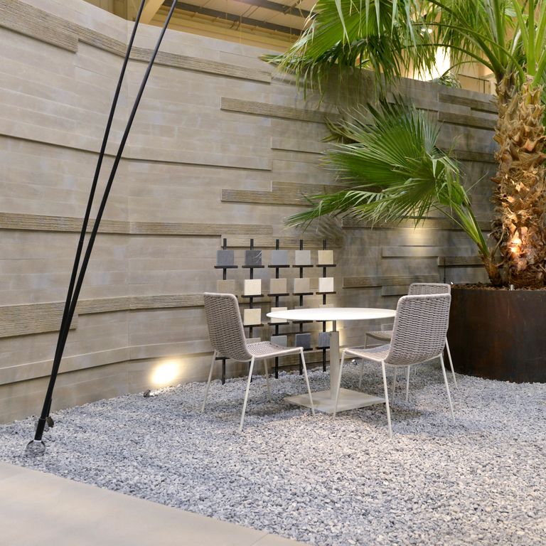 Application image for Sandstone - Bretagna Brown. The image shows this material being used for full bed veneer, thin veneer and interior cladding. The surface finish shown is . Dominant colors shown are brown and gray; with beige, blue, orange/rust, purple and tan secondaries. The color mix creates a warm feeling. Regular color pattern.