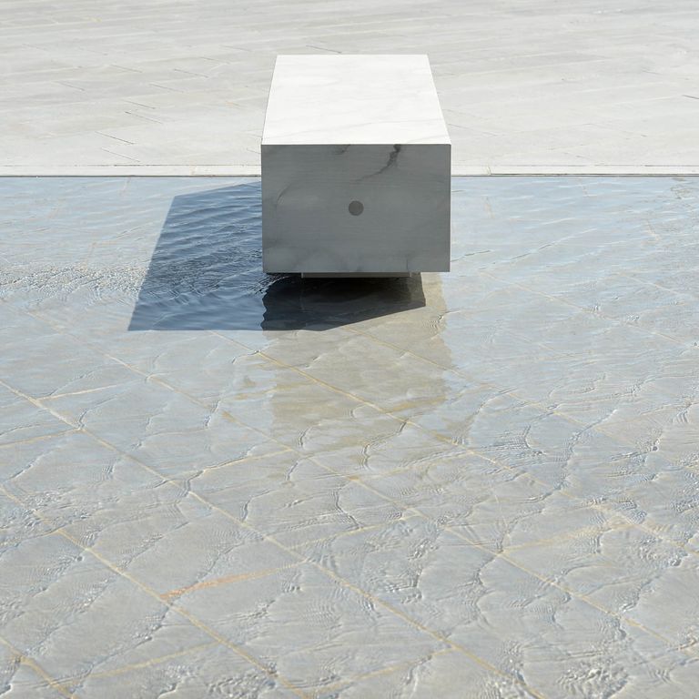 Application image for Pietra Forte Fiorentina Sandstone. The image shows this material being used for water features, seating & benches and patio pavers. The surface finish shown is honed. Dominant colors shown are gray and white; with beige, blue, pink and cream secondaries. The color mix creates a cool feeling. Regular color pattern.
