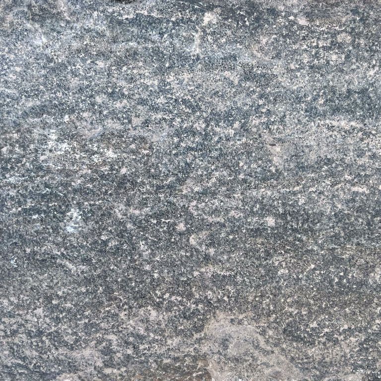 Swatch image for Reclaimed Quartzite Plank Pavers - Blue/Gray. The surface finish shown is a combination of split-face with flat plane, weathered and worn. The dominant color shown is gray; with blue, brown, green, purple and white secondaries. The color mix creates a cool feeling. Regular, fine speckled and random color patterns. Contains some mica.