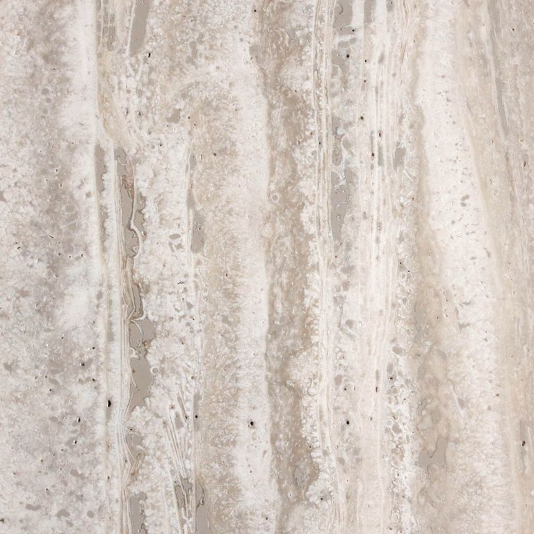 Feature image for Campione Travertine - Beige. The surface finish shown is honed. The dominant color shown is beige; with gray, pink, purple, white, tan and cream secondaries. The color mix creates a warm feeling. Streaked color pattern.