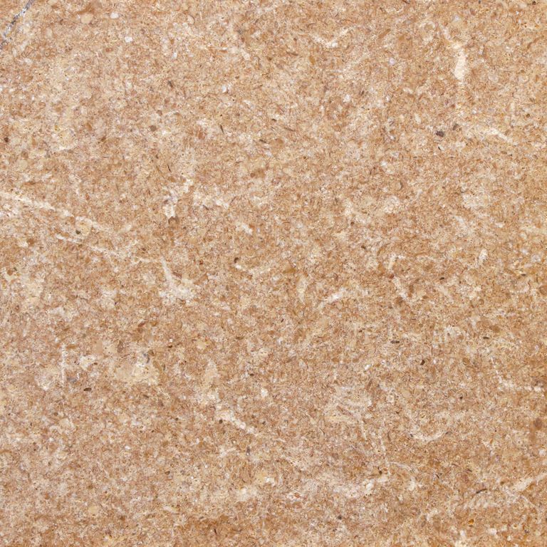 Color/Finish variation image for Marble - Golden Sinai. The surface finish shown is tumbled. Dominant colors shown are beige, orange/rust and tan. The color mix creates a warm feeling. Speckled and random color patterns.