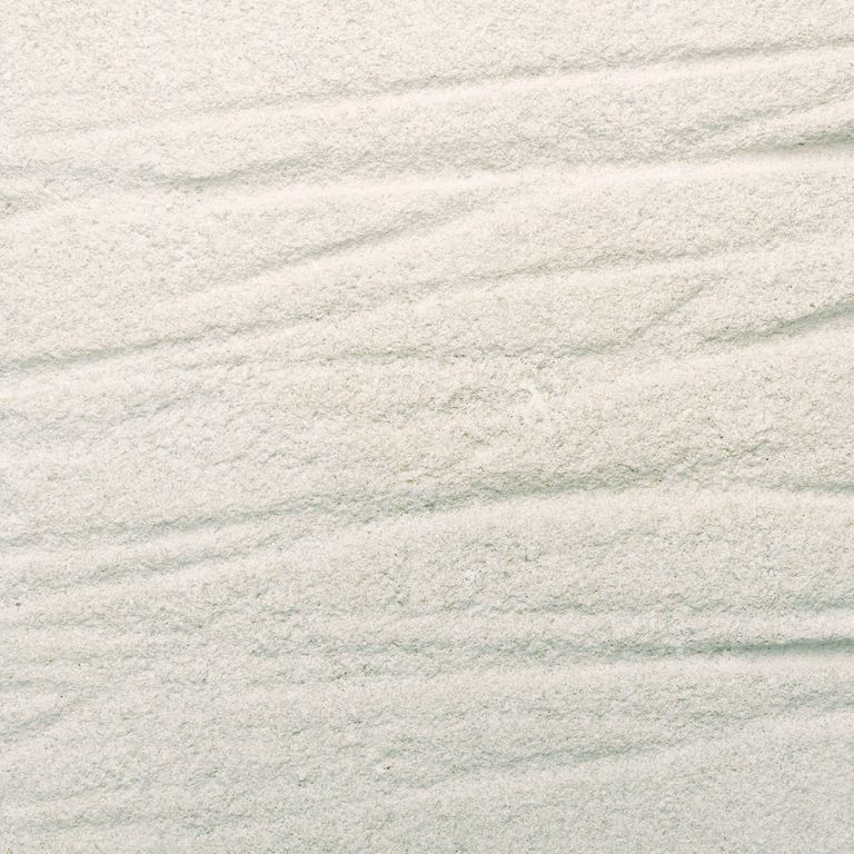 Feature image for Variegated Limestone. The surface finish shown is a combination of grooved and sand blasted. Dominant colors shown are beige, gray, white and cream. The color mix creates a warm feeling. Regular color pattern.