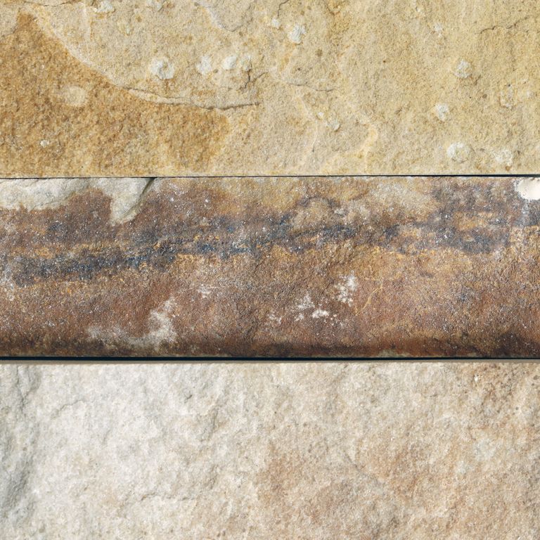 Color/Finish variation image for Harvest Gold Sandstone. The surface finish shown is a combination of natural and split-face. Dominant colors shown are beige, orange/rust and tan. Exhibits 