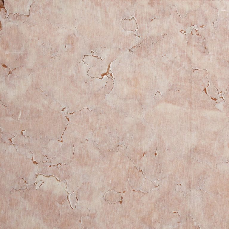 Color/Finish variation image for Coral Limestone. The surface finish shown is sawn. The dominant color shown is beige. The color mix creates a warm feeling. Cloudy color pattern. Contains voids.