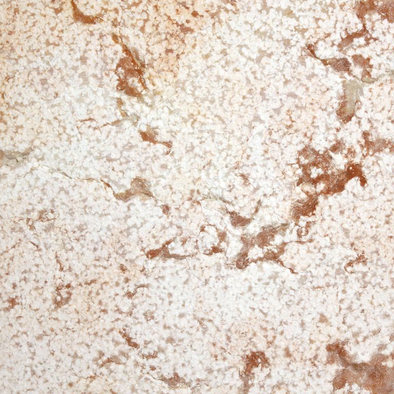 Feature image for Coral Limestone. The surface finish shown is bush hammered. Dominant colors shown are beige, white and cream. Exhibits 