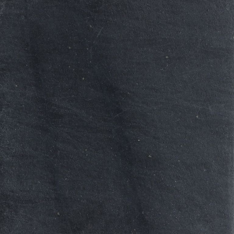 Feature image for Ribbon Black Slate. The surface finish shown is honed. The dominant color shown is black. The color mix creates a cool feeling. Streaked color pattern.