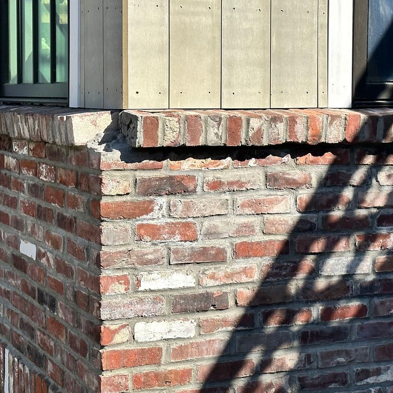Application image for Reclaimed Rail Station Brick. The image shows this material being used for full bed veneer and thin veneer. The surface finish shown is . Dominant colors shown are brown, gray, red and white. The color mix creates a warm feeling. Regular color pattern.