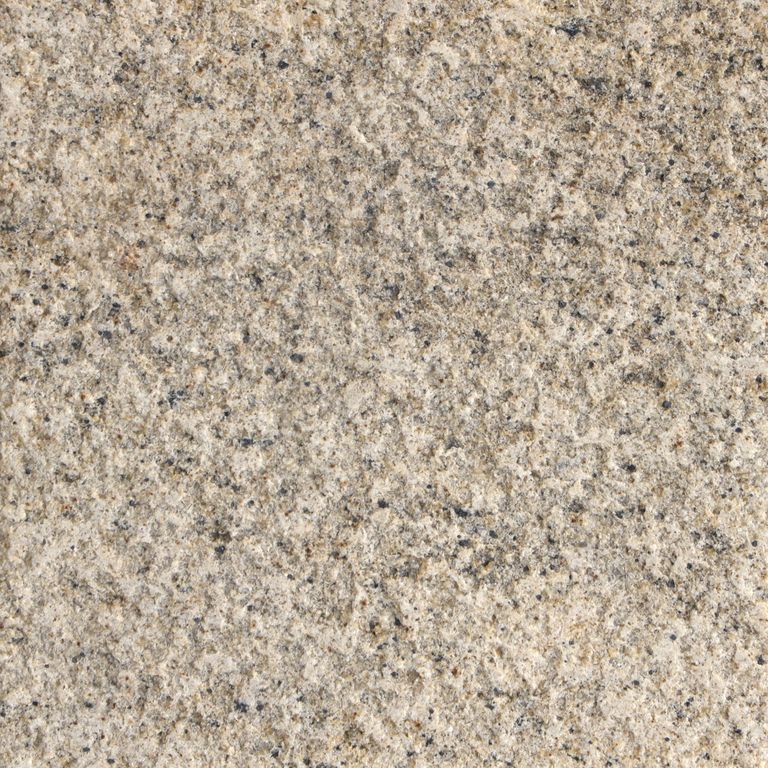 Best close-up image for Tanex Granite. The surface finish shown is sand blasted. Dominant colors shown are beige and tan. The color mix creates a warm feeling. Fine speckled and random color patterns.
