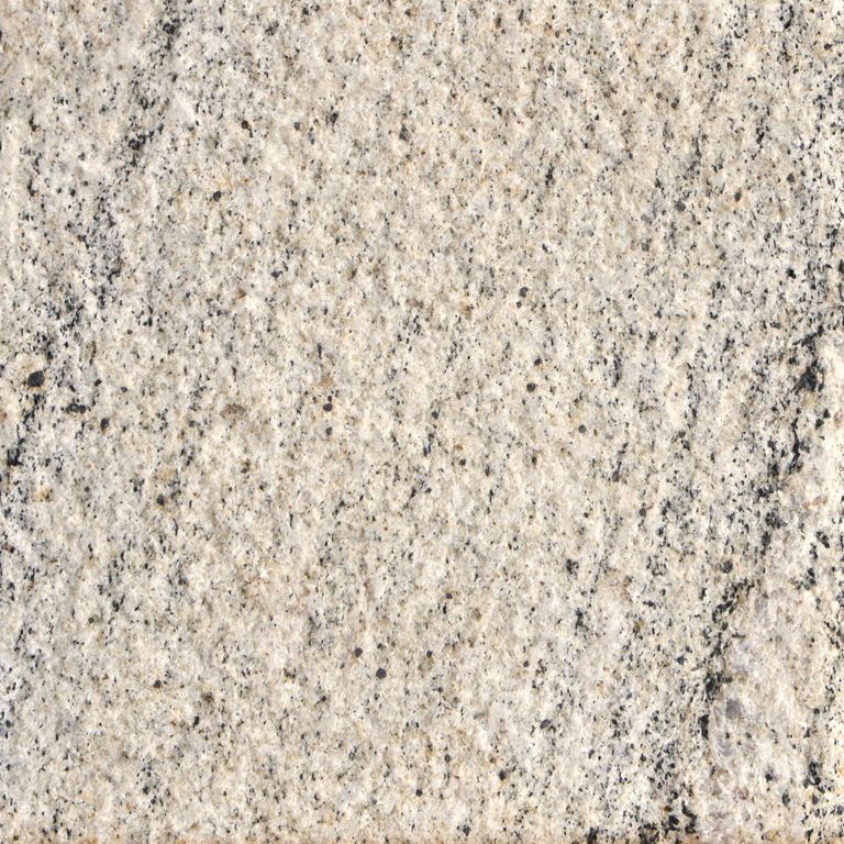 Feature image for Tanex Granite. The surface finish shown is sand blasted. The dominant color shown is beige. The color mix creates a warm feeling. Streaked and fine speckled color patterns.