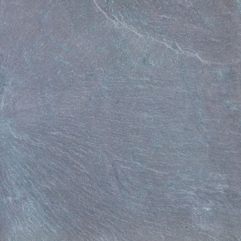 Feature image for Mottled Green Purple Slate. The surface finish shown is natural cleft. Dominant colors shown are blue and gray. The color mix creates a cool feeling. Regular color pattern.