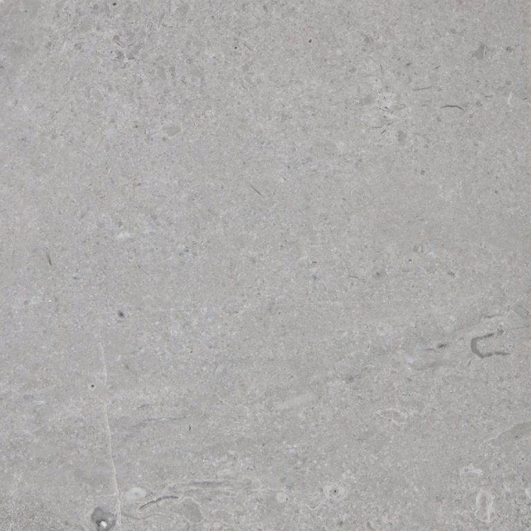 Color/Finish variation image for Northern Bay Limestone. The surface finish shown is polished. The dominant color shown is gray. The color mix creates a cool feeling. Fine speckled and cloudy color patterns.