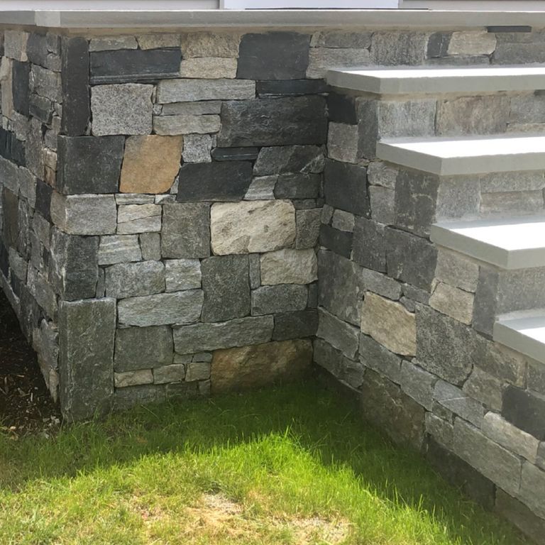 Application image for Granite - Windsor Blend Tin Veneer. The image shows this material being used in a thin veneer application. The surface finish shown is . The dominant color shown is gray. The color mix creates a warm feeling. Regular, streaked and random color patterns.