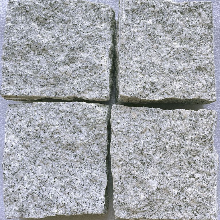 Feature image for Salt & Pepper Granite. The surface finish shown is split-face with flat plane. Dominant colors shown are blue and gray. The color mix creates a cool feeling. Fine speckled color pattern.