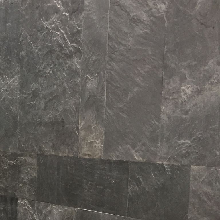 Best close-up image for Slate - Iberian Gray. The surface finish shown is natural cleft. Dominant colors shown are black, brown and gray. Exhibits 