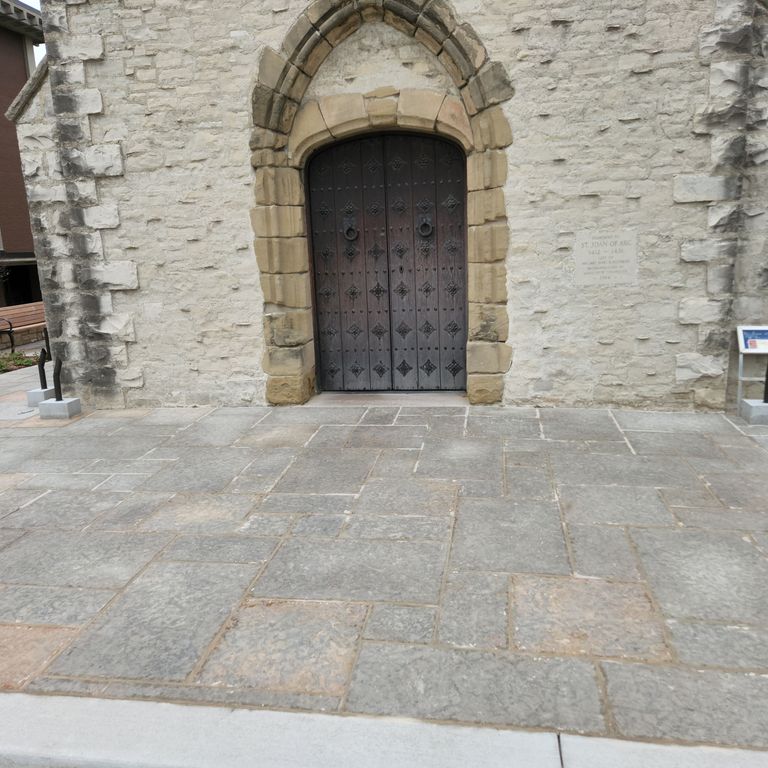 Application image for Limestone - Madison - Full Color. The image shows this material being used in a patio pavers application. The surface finish shown is flamed. The dominant color shown is gray.