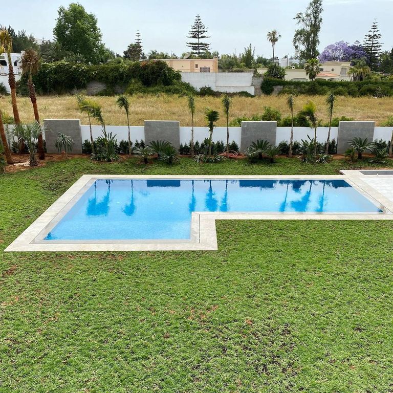 Application image for Limestone - Casablanca. The image shows this material being used in a pool coping application. The surface finish shown is . The dominant color shown is gray. The color mix creates a cool feeling.