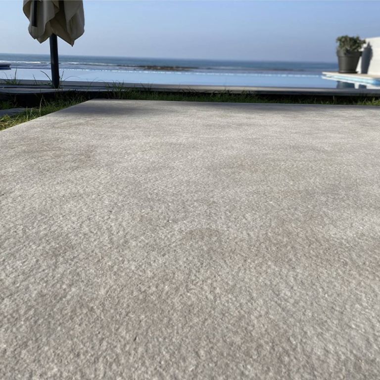 Application image for Limestone - Casablanca. The image shows this material being used in a pool coping application. The dominant color shown is gray. The color mix creates a cool feeling.