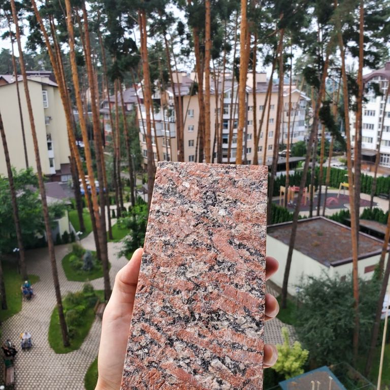 Feature image for Granite - Red Crystal. Dominant colors shown are black, gray, red and white. Coarse speckled color pattern.