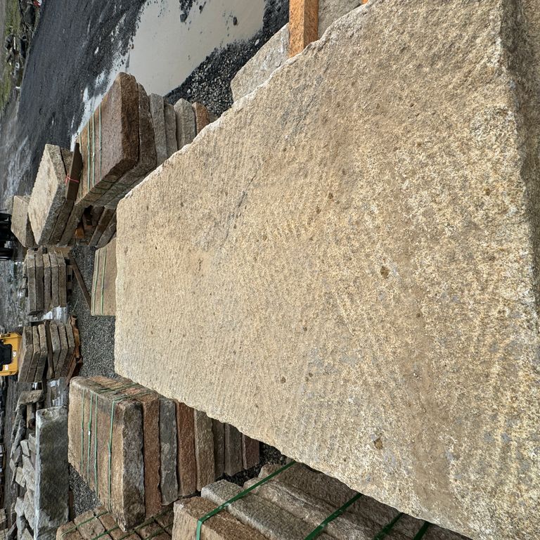 Best close-up image for Granite - Reclaimed Rustic Planks - Golden 4x2'. The surface finish shown is split-face. Dominant colors shown are brown and tan. The color mix creates a warm feeling.
