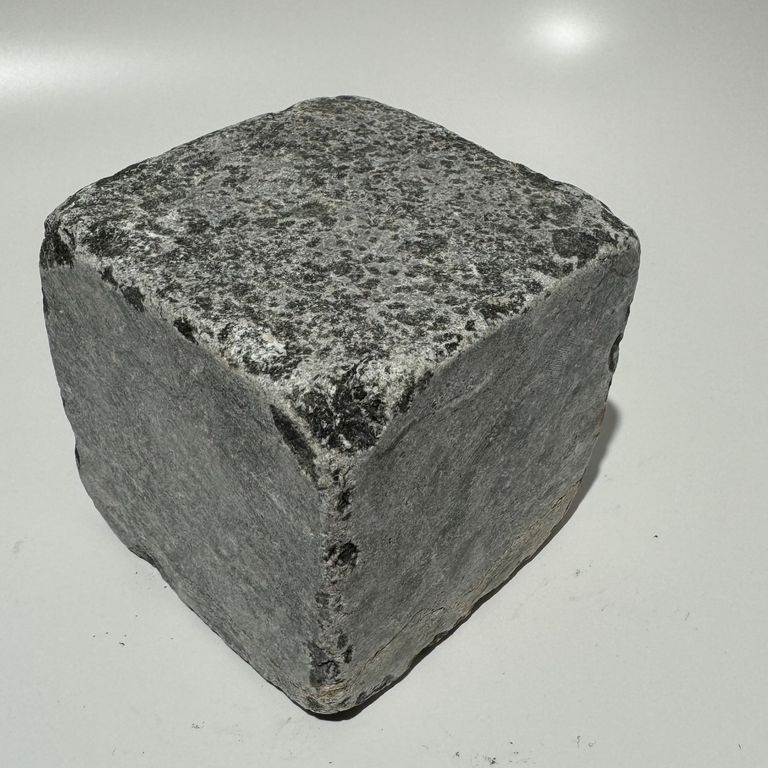 Oblique image for MARK 33b TESTING - Granite - Reclaimed Footworn Planks - Lona Test. The surface finish shown is coarse adze. The dominant color shown is gray. Fine speckled color pattern.