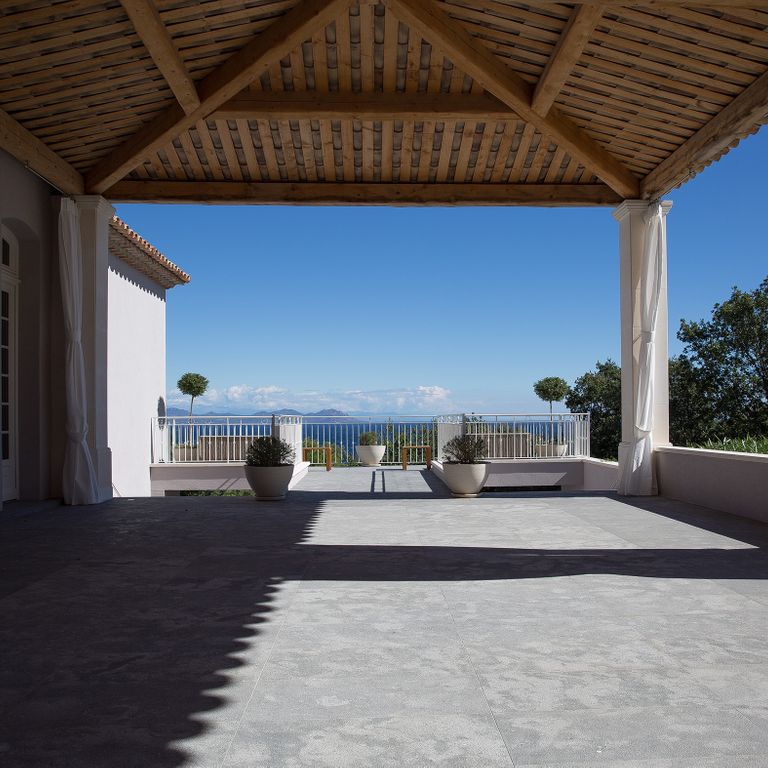Feature image for Montserrat Gray Limestone. The image shows this material being used in a patio pavers application. The dominant color shown is gray. The color mix creates a cool feeling.