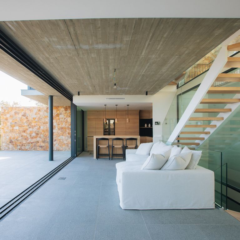 Application image for Montserrat Gray Limestone. The image shows this material being used for interior floor and patio pavers. The dominant color shown is gray. The color mix creates a cool feeling.