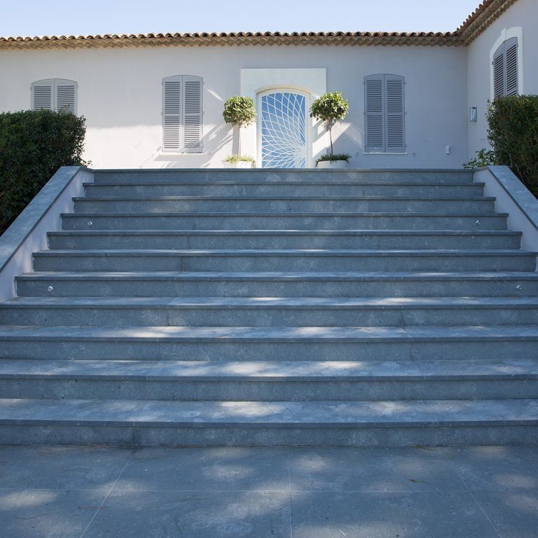 Application image for Montserrat Gray Limestone. The image shows this material being used in a treads application. The dominant color shown is gray.
