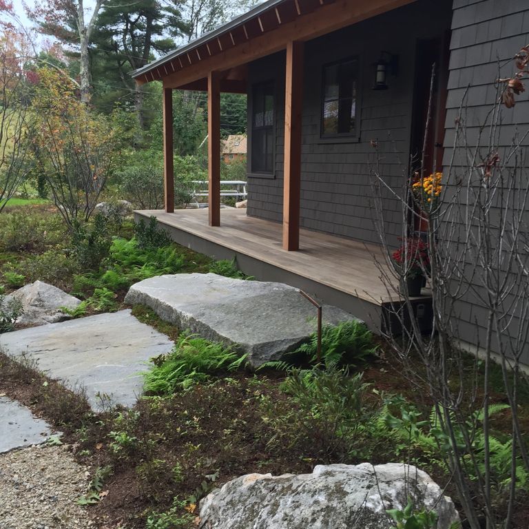 The image shows this material being used for landings and monolithic steps. The dominant color shown is gray.