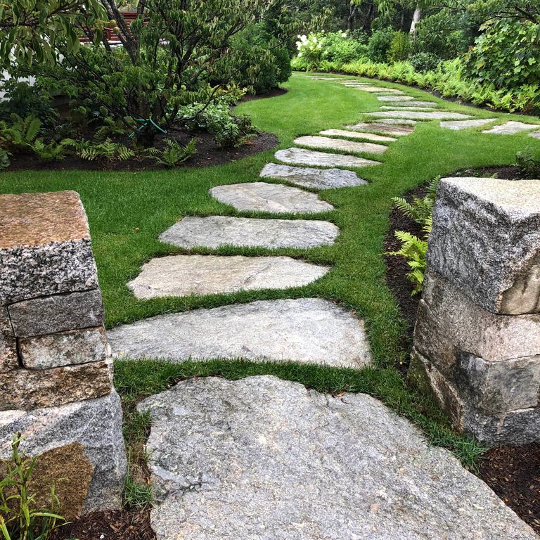 The image shows this material being used in a path pavers application.