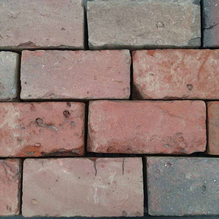 Application image for Brick - Reclaimed Boston Pavers. The surface finish shown is . Dominant colors shown are brown, gray and red. The color mix creates a warm feeling. Regular color pattern.