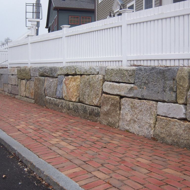 Application image for Reclaimed Granite Block. The image shows this material being used in a thin veneer application. Dominant colors shown are brown and gray. The color mix creates a warm feeling.