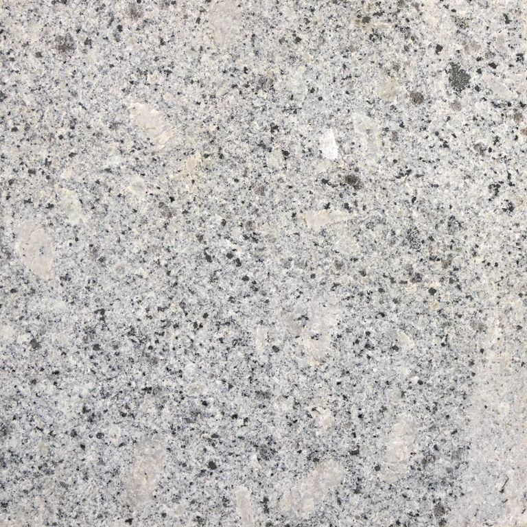 Color/Finish variation image for Oak Mountain Granite. The surface finish shown is flamed. The dominant color shown is gray; with beige, pink, white and cream secondaries. Exhibits 