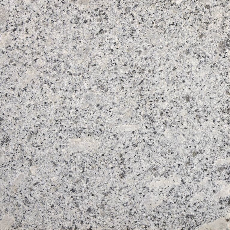 Color/Finish variation image for Oak Mountain Granite. The surface finish shown is flamed. The dominant color shown is gray; with beige, pink, purple, white and cream secondaries. The color mix creates a cool feeling. Regular, speckled and blotched color patterns.
