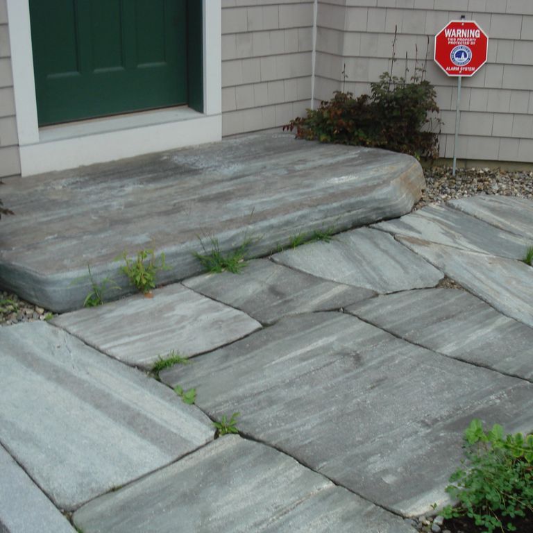 The image shows this material being used for path pavers, patio pavers and landings. The dominant color shown is gray; with blue, brown and white secondaries. Linear and streaked color patterns.