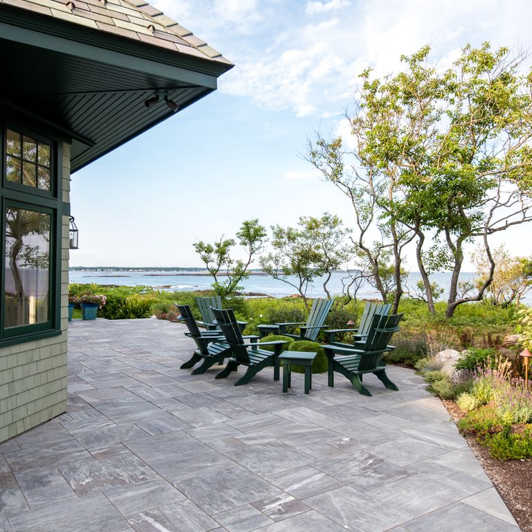 Application image for Mystic Mountain - Worked Surface. The image shows this material being used in a patio pavers application. The surface finish shown is flamed. Dominant colors shown are blue and gray; with blue and white secondaries. The color mix creates a cool feeling. Linear and veined color patterns.