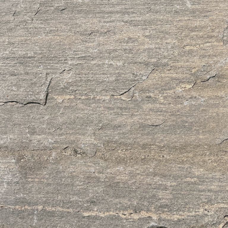 The surface finish shown is natural cleft. The dominant color shown is gray. The color mix creates a warm feeling. Streaked color pattern.