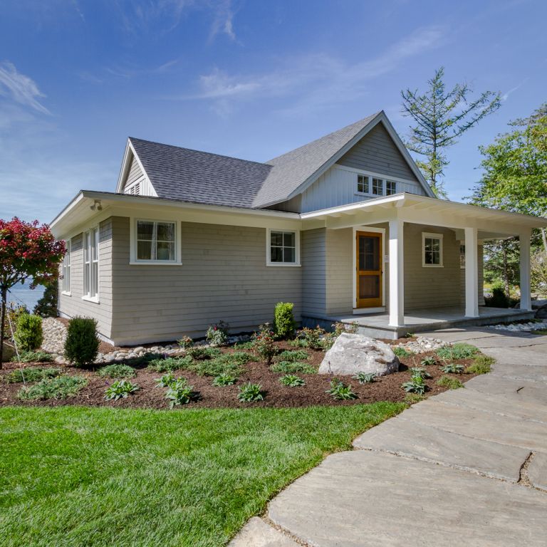 Application image for Mystic Mountain - Natural. The image shows this material being used in a path pavers application. The surface finish shown is natural cleft. The dominant color shown is gray. Exhibits 