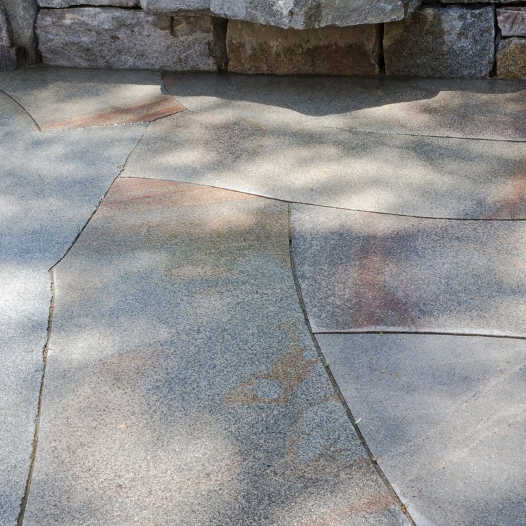 Application image for Granite - Cape Neddick Full Color. The image shows this material being used in a patio pavers application.
