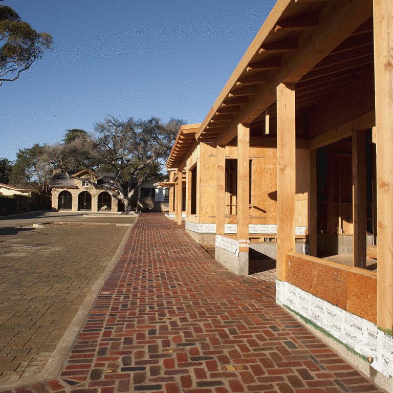 The image shows this material being used in a path pavers application.