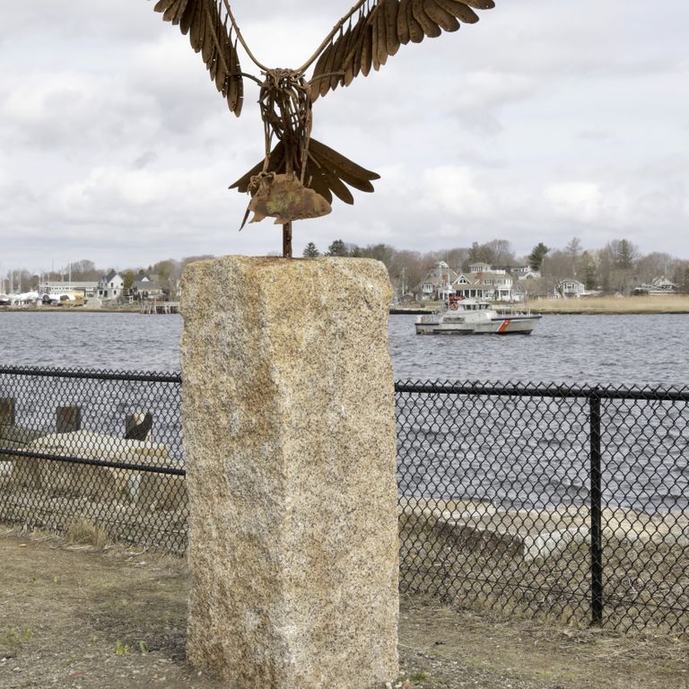 Application image for Reclaimed Granite Bridge Blocks. The image shows this material being used in a columns application. The surface finish shown is weathered. The dominant color shown is tan; with brown, gray and orange/rust secondaries. The color mix creates a warm feeling.