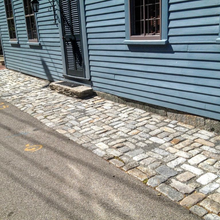 The image shows this material being used in a path pavers application.