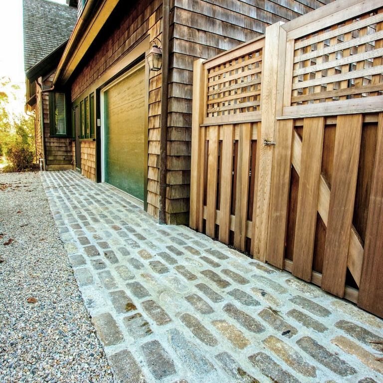 The image shows this material being used in a path pavers application.