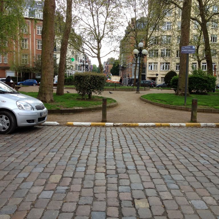 Application image for Granite - Reclaimed Swedish Cobblestones. The image shows this material being used in a driveway pavers application. The surface finish shown is antiqued. Dominant colors shown are brown and gray. The color mix creates a warm feeling.
