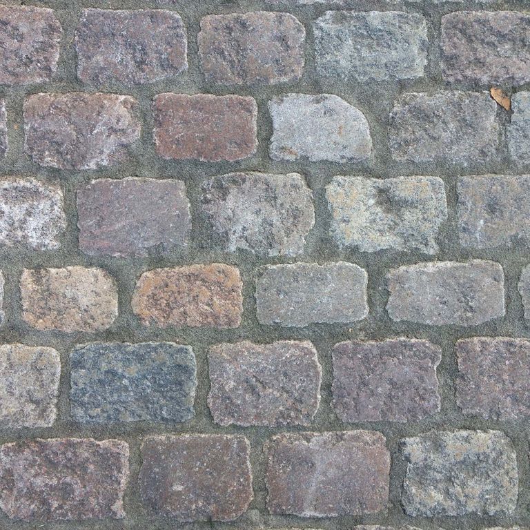 Application image for Reclaimed Swedish Granite Cobblestones. The surface finish shown is antiqued. The dominant color shown is gray. The color mix creates a cool feeling.