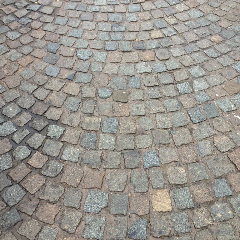 Application image for Reclaimed European Porphyry Cobblestones. The surface finish shown is . The dominant color shown is gray. The color mix creates a warm feeling.